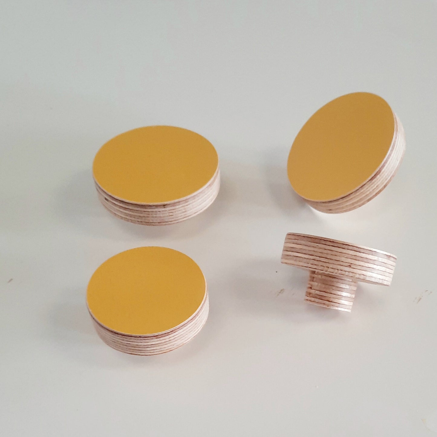 yellow round plywood knobs