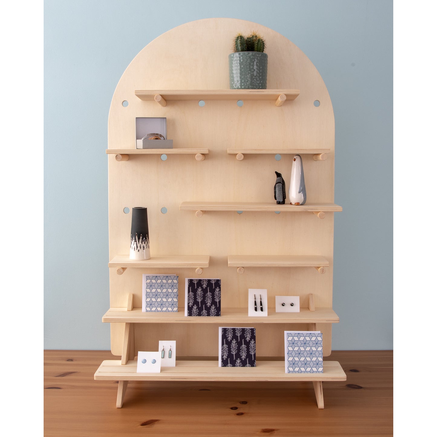 Curved Table Top Pegboard Display Stand with Tiered Shelving