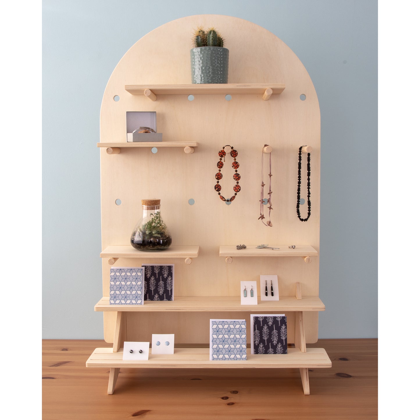 Curved Table Top Pegboard Display Stand with Tiered Shelving