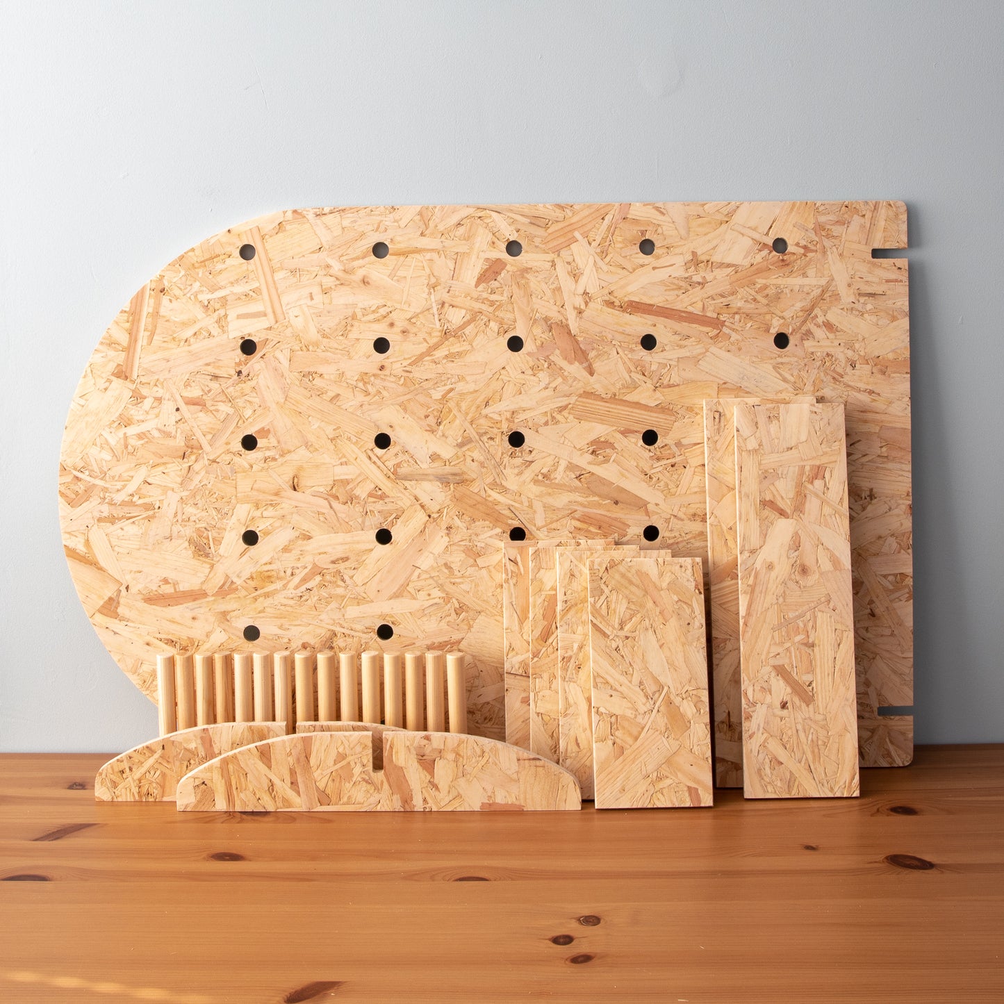 Curved OSB Table Top Pegboard Display Stand